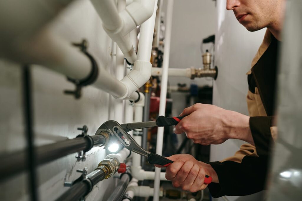 Plumbers maintaining commercial plumbing pipes in Cartersville