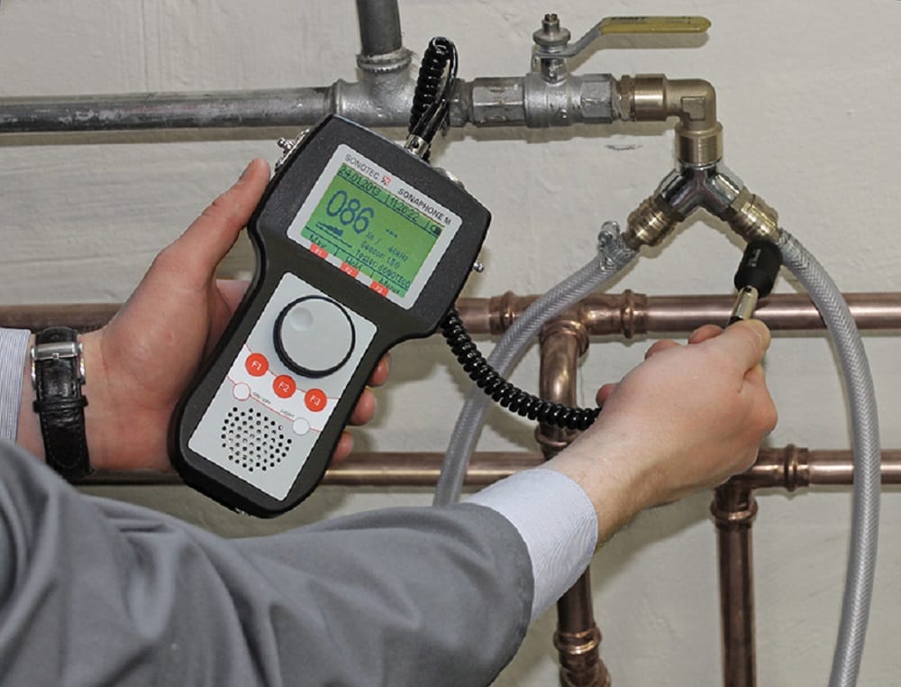 Plumber testing pipes with electronic leak detection equipment in Cartersville