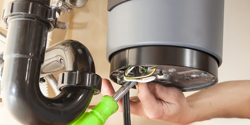 Technician repairing the heating element of a water heater in Cartersville